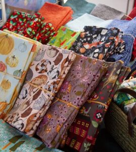 Colorful placemats, table runners, napkins and more from Such Pretty Colors by Ann Sheppard. The Sunday Artisan Market, Ann Arbor, Michigan.