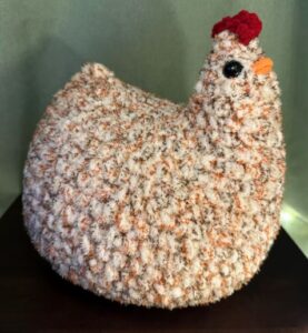 Crochet Li'l Guys, Crocheted animals, shirts, hats and sweaters by Sam Greco. The Sunday Artisan Market, Ann Arbor, Michigan.